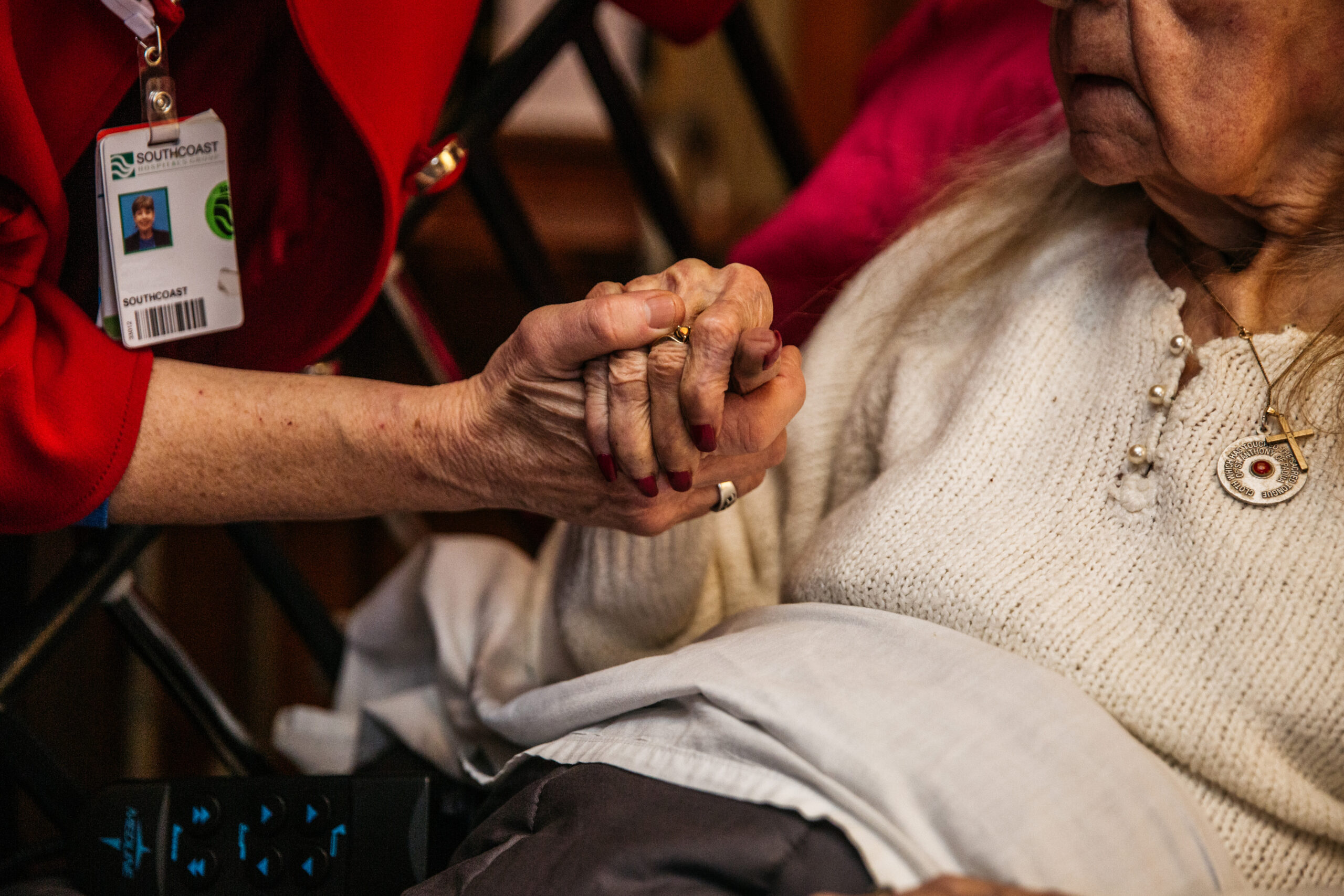 Provider and patient holding hands